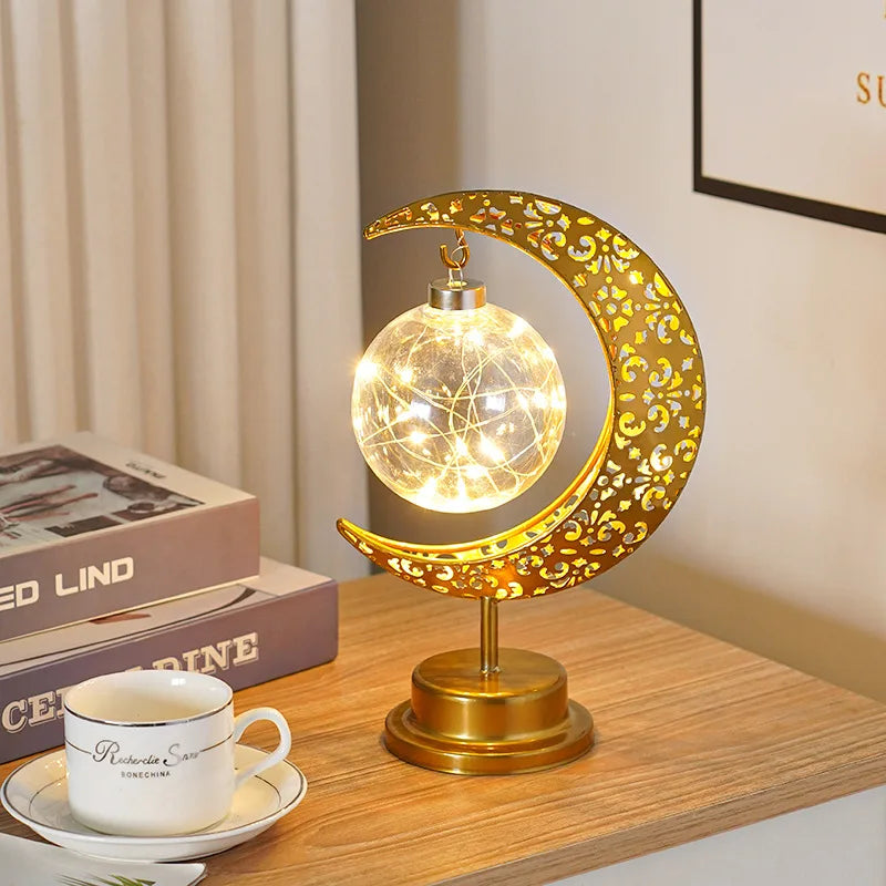 Crescent with hanging pendant LED light